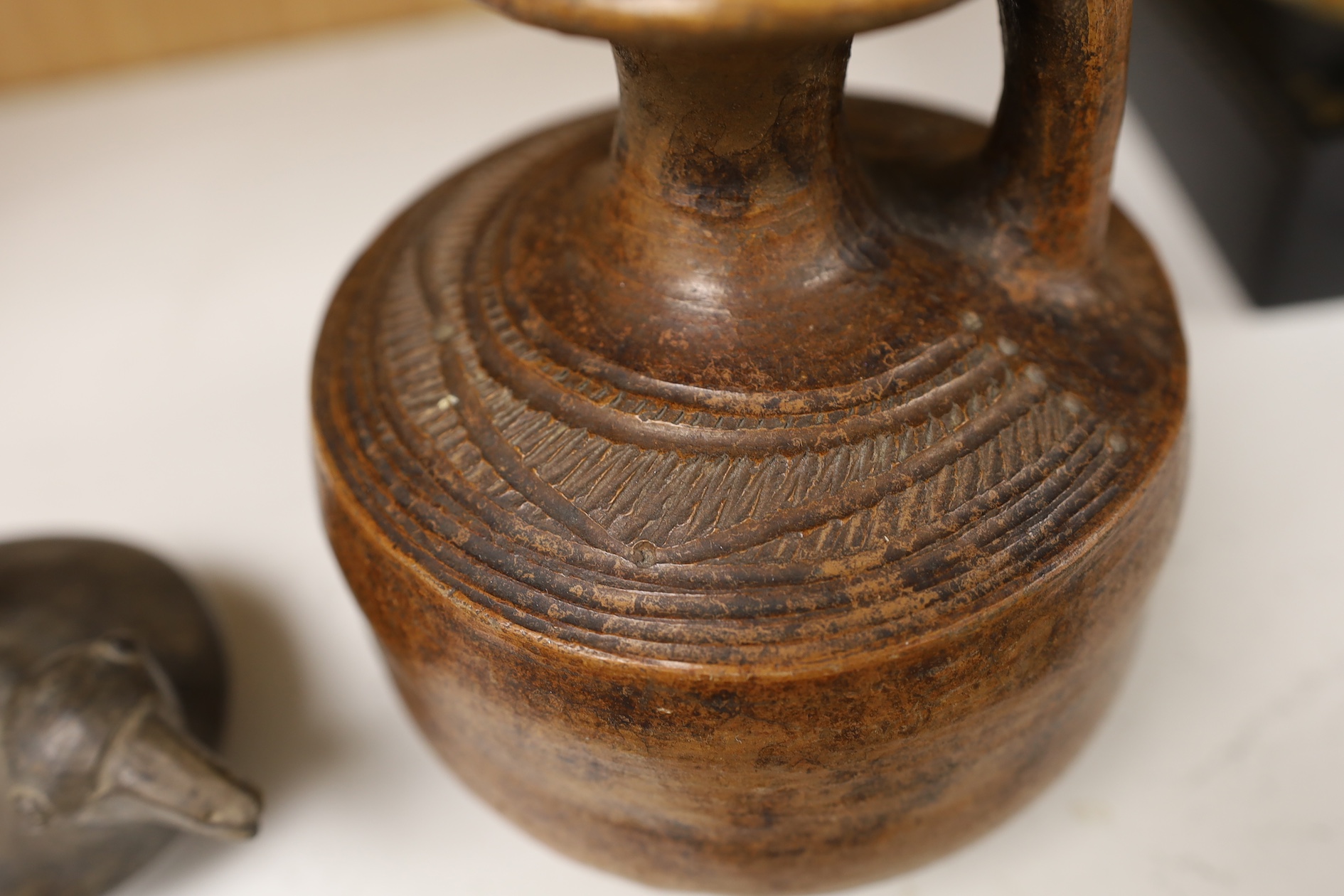 A black pottery bird vessel, probably pre-Columbian and a burnished terracotta jug, largest 15cm high. Condition - good for age